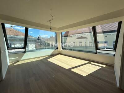 Dachgeschosswohnung kaufen in 1050 Wien